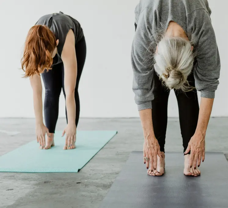 ladies exercising on yoga mat