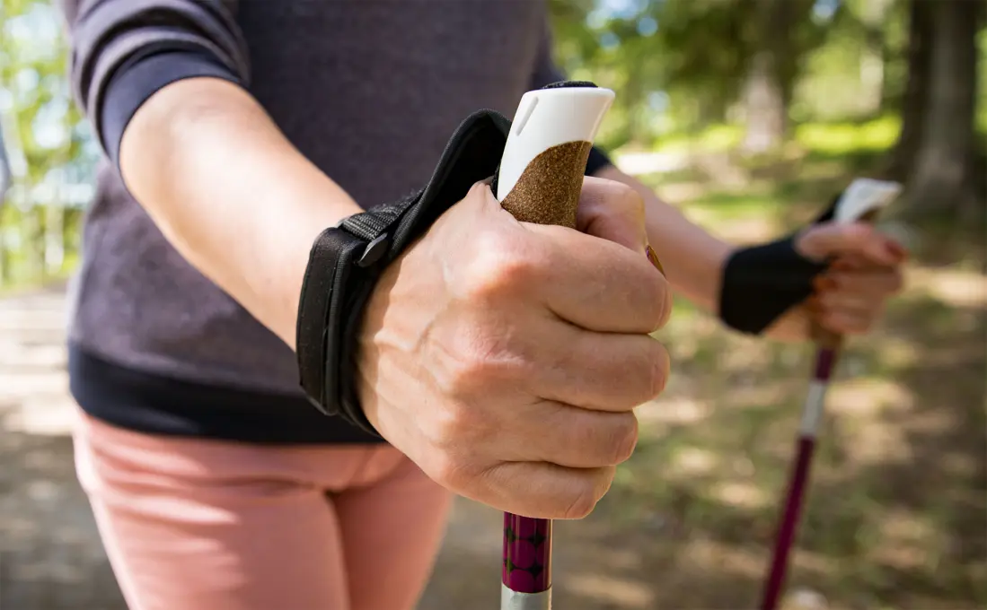 women walking with walking sticks